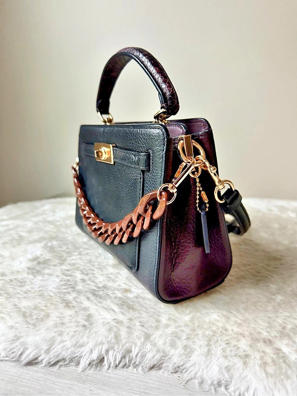 Coach Mini Lane Top Handle purse in black and brown Leather with chain charm